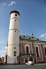 Kostel Narození Panny Marie s válcovitou věží, která původně ke kostelu nenáležela a bývala hláskou, je dominantou náměstí. První zmínky o kostele se datují k roku 1385, ale pozdější zprávy udávají rok založení 1111. Toto datum je také vepsáno na klenebním oblouku nad kruchtou. Z původní gotické stavby zůstaly zachovány křížové klenby boční lodi a profilované portály. Po požáru města roku 1747 byl kostel v letech 1751-56 barokně přestavěn. Klenutí chrámové lodi je zdobeno freskami F. J. Luxe z roku 1756. Mezi skvosty náleží oltář Narození Panny Marie, dílo pražských mistrů. Ve věži je kromě zvonů Zikmund, Poledník, Hodinka umístěn na ochozu zvonek "Advent" u 15. století, na který se zvoní v předvánočním období.