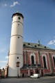 Kostel Narození Panny Marie s válcovitou věží, která původně ke kostelu nenáležela a bývala hláskou, je dominantou náměstí. První zmínky o kostele se datují k roku 1385, ale pozdější zprávy udávají rok založení 1111. Toto datum je také vepsáno na klenebním oblouku nad kruchtou. Z původní gotické stavby zůstaly zachovány křížové klenby boční lodi a profilované portály. Po požáru města roku 1747 byl kostel v letech 1751-56 barokně přestavěn. Klenutí chrámové lodi je zdobeno freskami F. J. Luxe z roku 1756. Mezi skvosty náleží oltář Narození Panny Marie, dílo pražských mistrů. Ve věži je kromě zvonů Zikmund, Poledník, Hodinka umístěn na ochozu zvonek "Advent" u 15. století, na který se zvoní v předvánočním období.