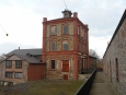Budova nad dolem Vojtěch, který je držitelem světového prvenství svislé hloubky 1000 m, dosažené roku 1875.