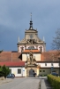 Impozantní barokní klášter podle návrhu A. Spezzy založil v roce 1627 Albrecht z Valdštejna. V roce 1782 byl však Josefem II. zrušen. Poté zde bylo vojenské skladiště, sýpky nebo kanceláře. Po odchodu úředníků areál chátral. Uplatnění se našlo v letech 1855-57, kdy byl upraven vídeňským architektem Wehrenfenningem na trestnici, která se zde nachází dodnes a je jedním z nejpřísnějších vězení v zemi. (Mapy.cz)
